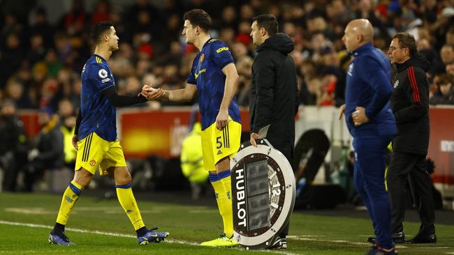 FOTO : Cristiano Ronaldo dan Harry Maguire di Manchester United. (Action Images via Reuters/ANDREW BOYERS)